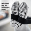 Sohlenansicht der weißen grippyglow Pilates Socken mit Herz-Noppen – Anti-Rutsch-Profil für sicheren Halt auf dem Reformer-Gerät